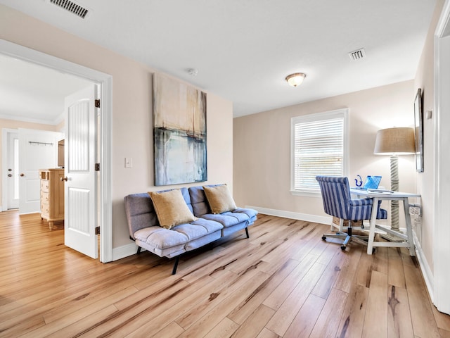 office with light hardwood / wood-style floors