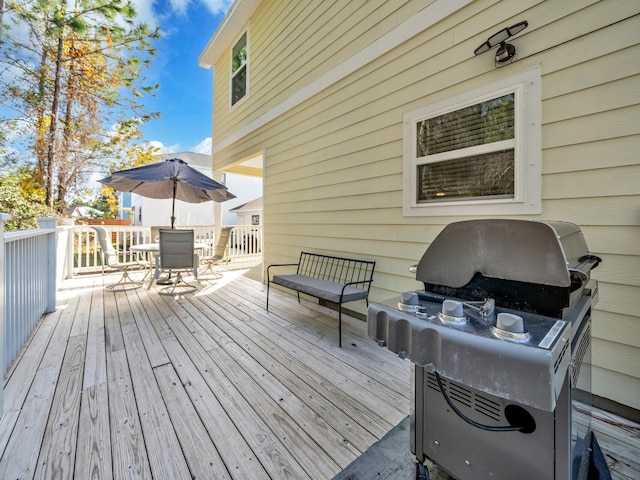 wooden terrace with area for grilling