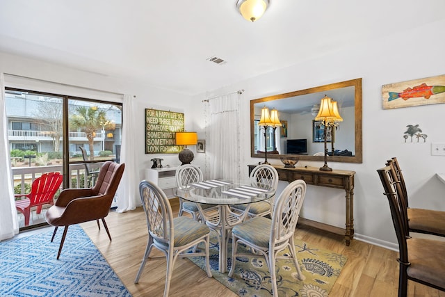 dining room with light wood-type flooring