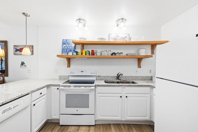 3799 E County Highway 30a # E-6, Santa Rosa Beach, FL 32459 - kitchen with white appliances, open shelves, white cabinetry, light wood finished floors, and light stone countertops