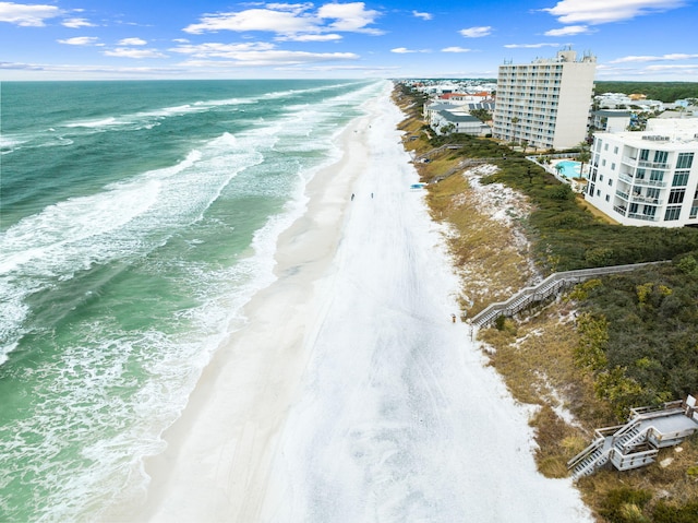 birds eye view of property with a view of the beach and a water view