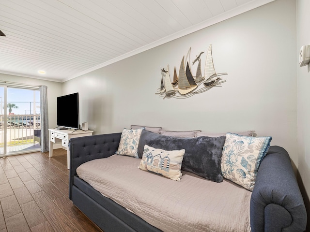 bedroom with wood ceiling, ornamental molding, dark wood-type flooring, and access to outside