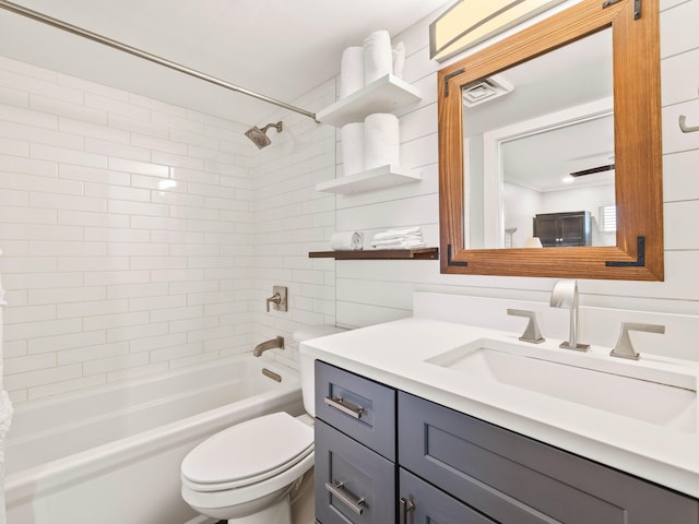 full bathroom with vanity, toilet, and tiled shower / bath