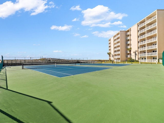 view of tennis court featuring basketball court