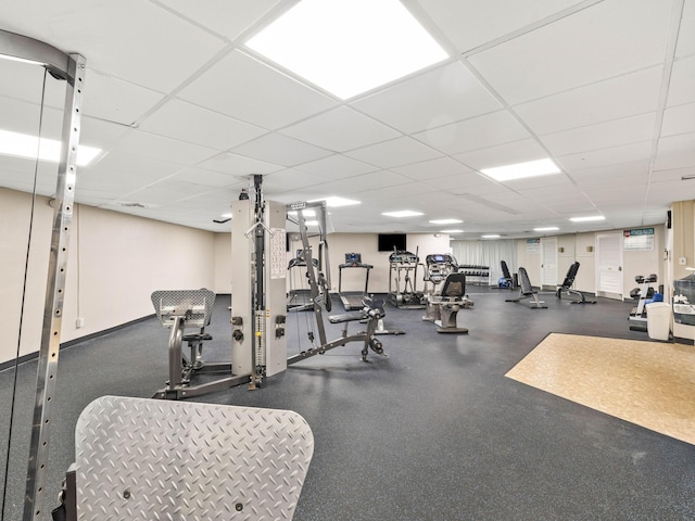 exercise room with a drop ceiling