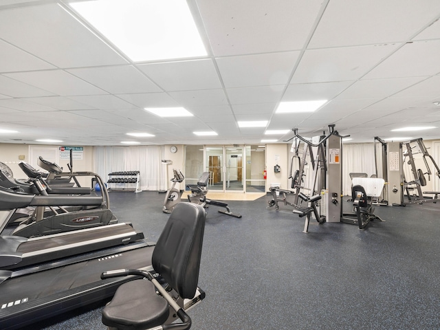 exercise room featuring a paneled ceiling