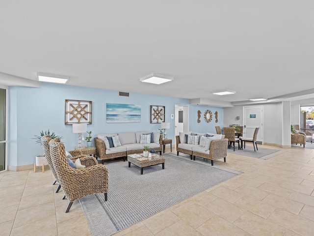 living room with light tile patterned floors