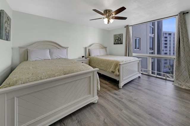 bedroom with hardwood / wood-style flooring and ceiling fan