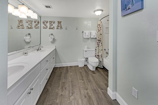 full bathroom with toilet, vanity, shower / bath combo, and hardwood / wood-style flooring