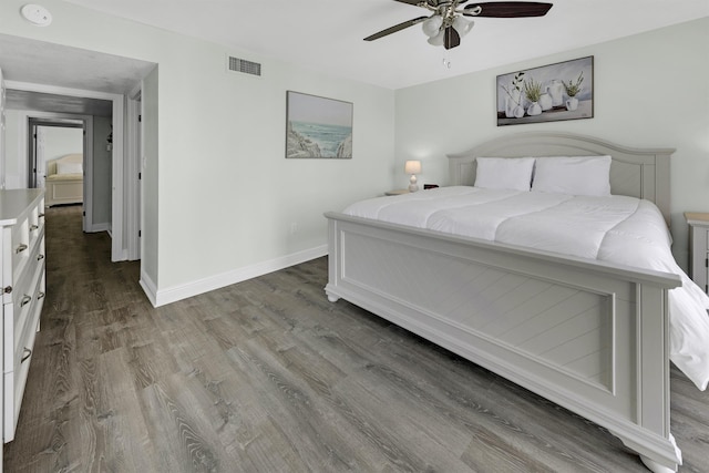 bedroom featuring hardwood / wood-style flooring and ceiling fan