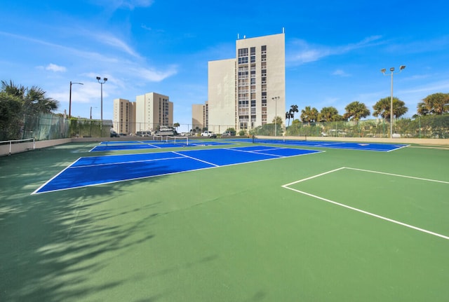 view of sport court with basketball hoop