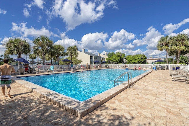 view of swimming pool featuring a patio area