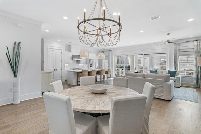 1016 Pathways Dr, Inlet Beach, FL 32461 - dining area with ornamental molding, a ceiling fan, recessed lighting, light wood-type flooring, and a chandelier
