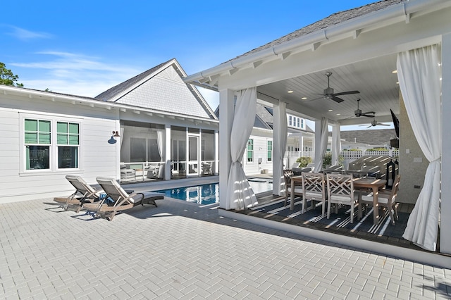 1016 Pathways Dr, Inlet Beach, FL 32461 - view of patio / terrace with a ceiling fan, an outdoor pool, a sunroom, and outdoor dining space
