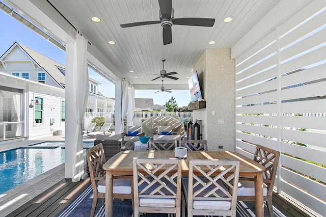 view of patio / terrace with a swimming pool side deck and ceiling fan