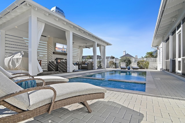 view of pool featuring a patio area and ceiling fan