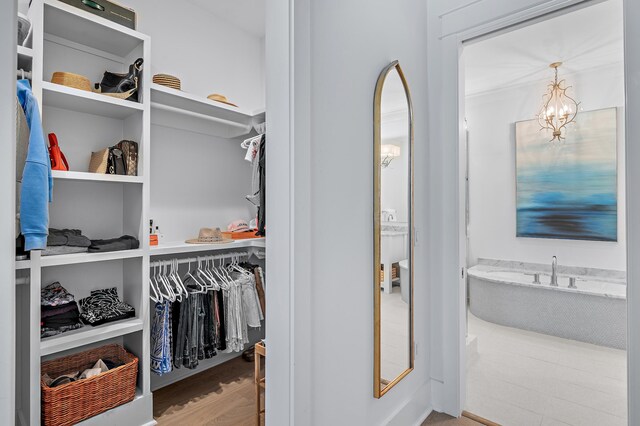 1016 Pathways Dr, Inlet Beach, FL 32461 - walk in closet featuring a chandelier
