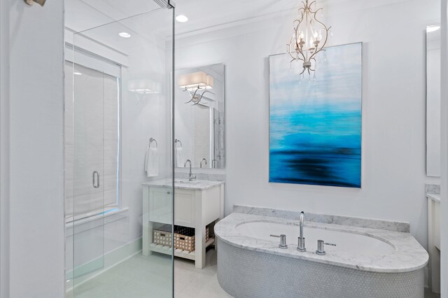 bathroom with crown molding, tile patterned flooring, vanity, and shower with separate bathtub