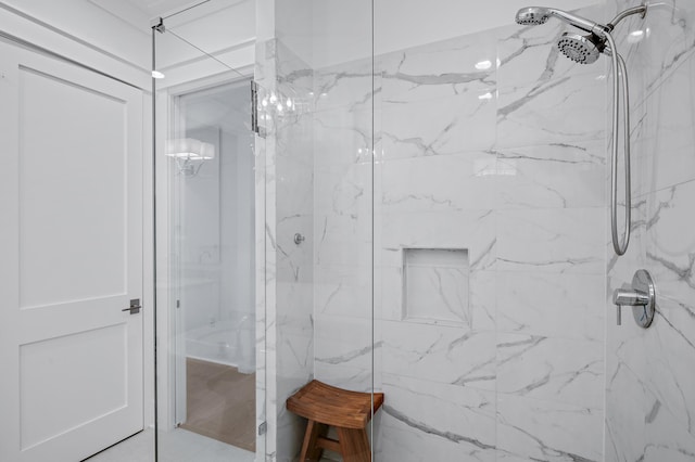 bathroom featuring tiled shower