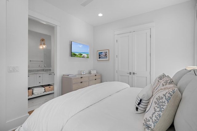 1016 Pathways Dr, Inlet Beach, FL 32461 - bedroom featuring marble look tile flooring, a closet, recessed lighting, and ensuite bath