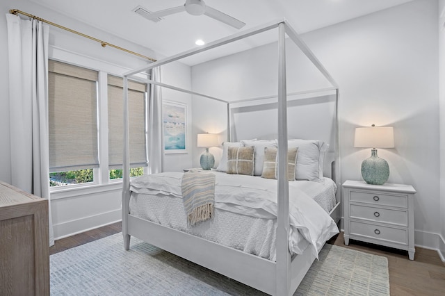 bedroom featuring ceiling fan and dark wood-type flooring