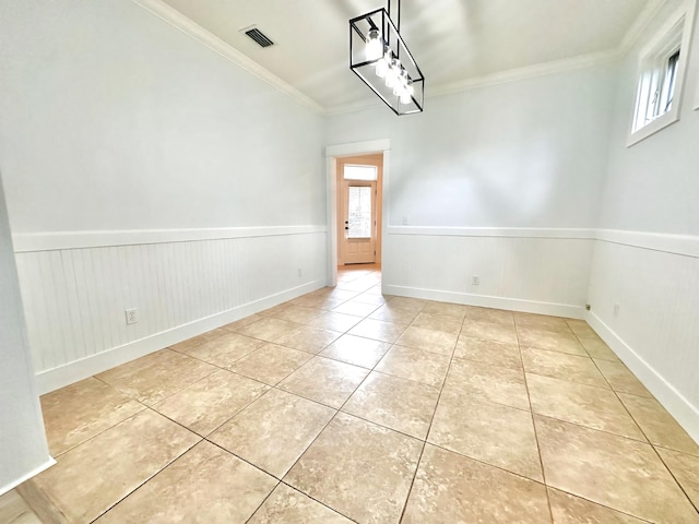 unfurnished dining area with ornamental molding and light tile patterned floors