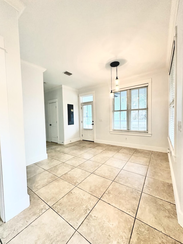 empty room featuring light tile patterned floors and electric panel