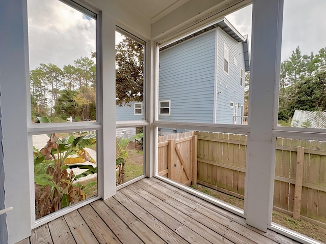 unfurnished sunroom with plenty of natural light