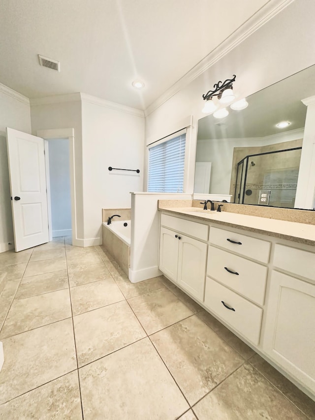 bathroom featuring tile patterned floors, vanity, separate shower and tub, and ornamental molding