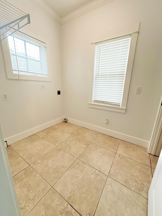 tiled empty room with crown molding