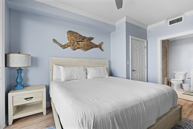 bedroom with hardwood / wood-style flooring, ceiling fan, ornamental molding, a textured ceiling, and connected bathroom