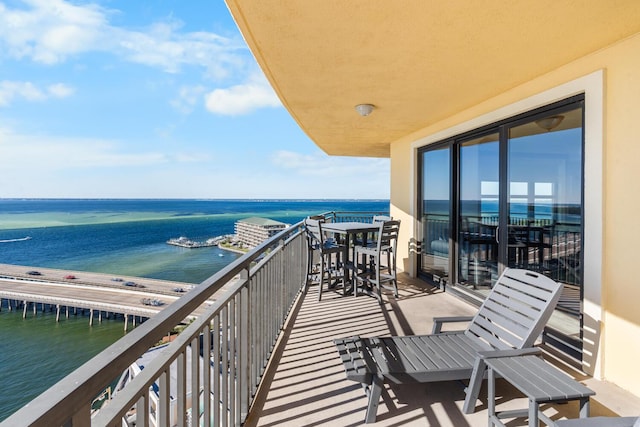 balcony featuring a water view