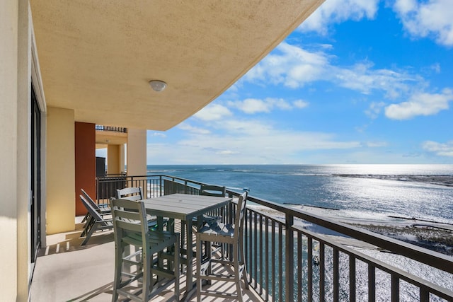 balcony featuring a water view