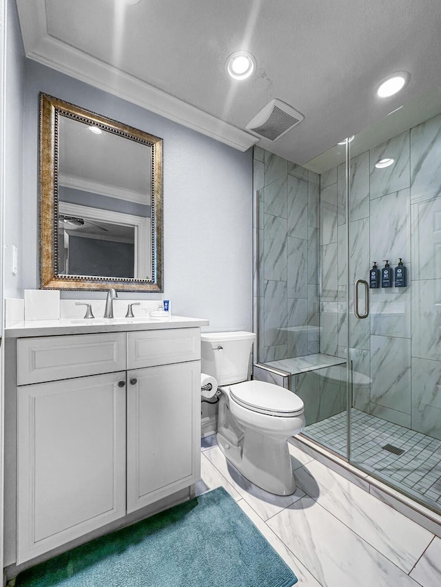 bathroom featuring vanity, toilet, walk in shower, and ornamental molding