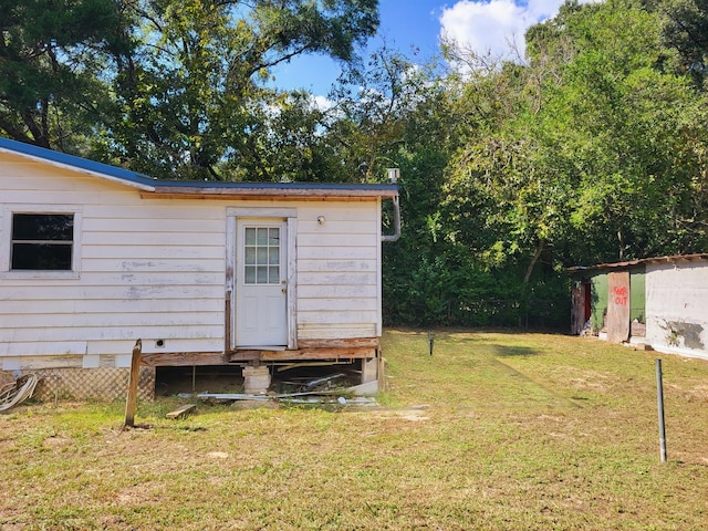 exterior space featuring a lawn