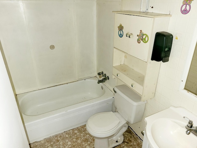 bathroom with sink, tile walls, and toilet