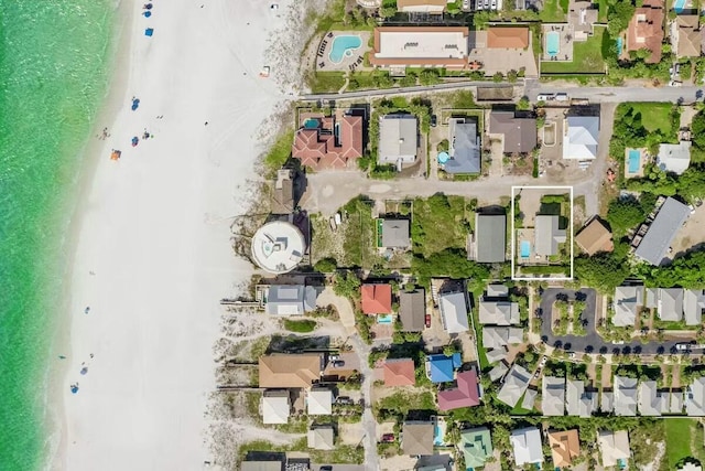 aerial view with a view of the beach and a water view