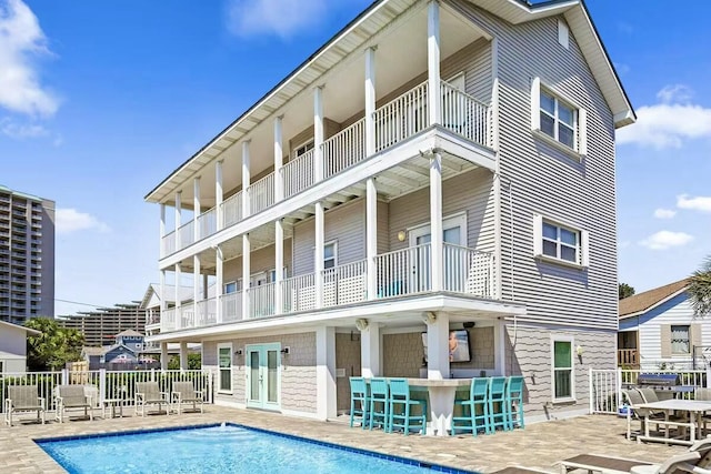 exterior space with a patio area and a community pool