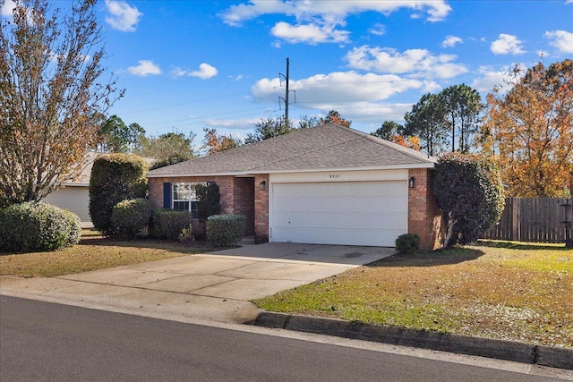 ranch-style home featuring a front yard and a garage