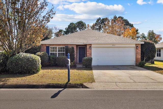 ranch-style home featuring a garage and a front lawn