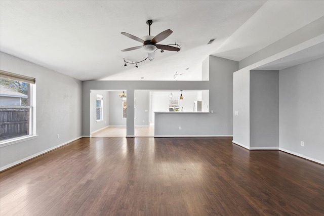 unfurnished living room featuring hardwood / wood-style flooring, ceiling fan, and high vaulted ceiling