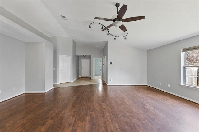 unfurnished living room with hardwood / wood-style flooring, ceiling fan, and lofted ceiling