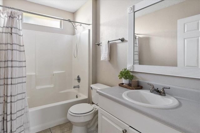 full bathroom with tile patterned floors, vanity, toilet, and shower / bath combo with shower curtain