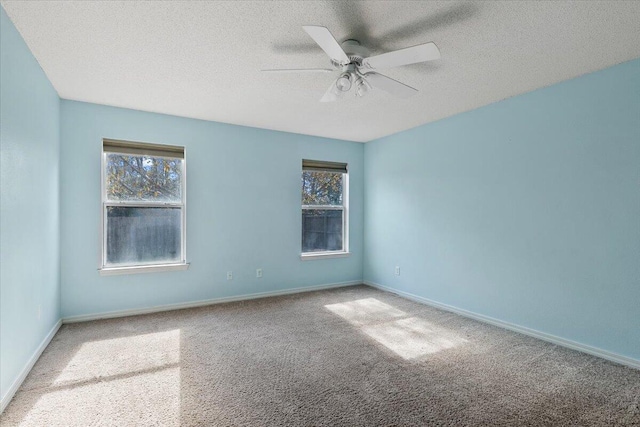 unfurnished room with carpet, a textured ceiling, and ceiling fan