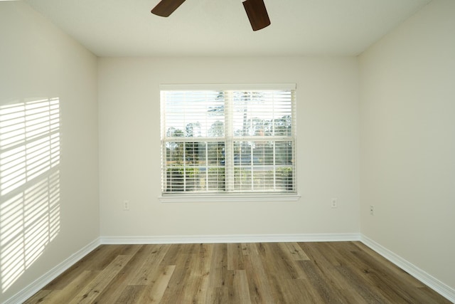 unfurnished room with hardwood / wood-style floors