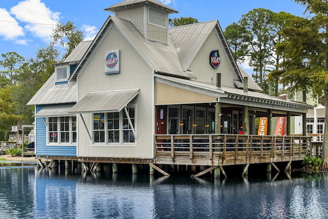 rear view of house with a water view