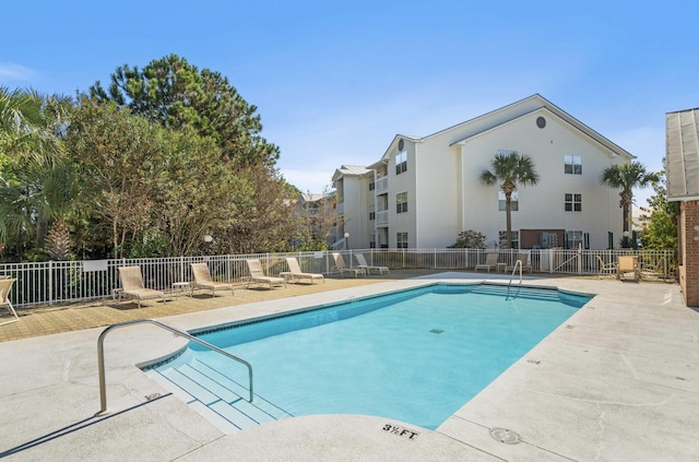 view of pool featuring a patio