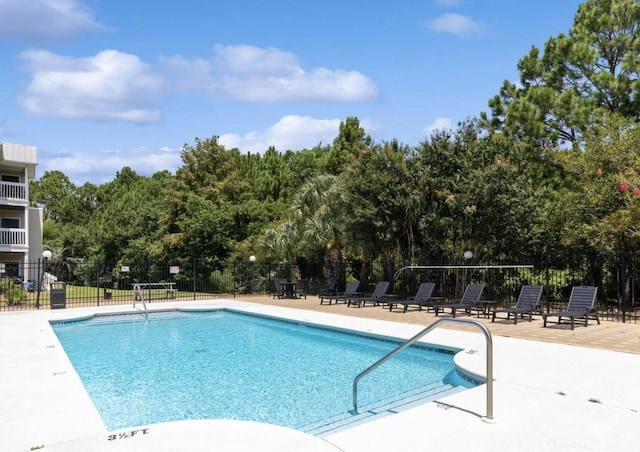 view of pool featuring a patio area