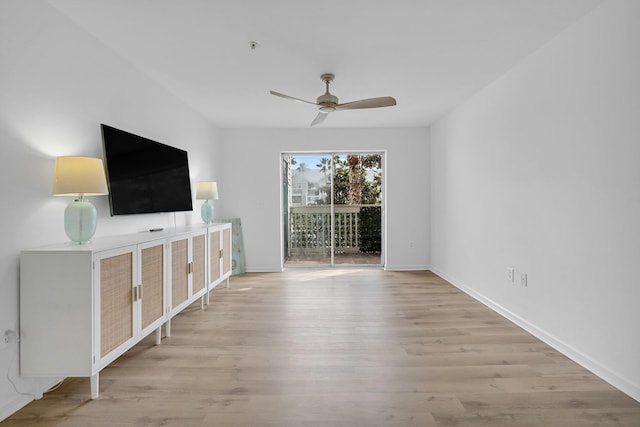 unfurnished living room featuring light wood-type flooring and ceiling fan