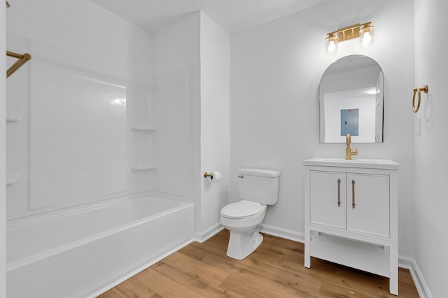 full bathroom with hardwood / wood-style floors, vanity, toilet, and shower / washtub combination